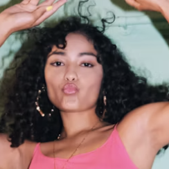 Woman taking selfie indoors